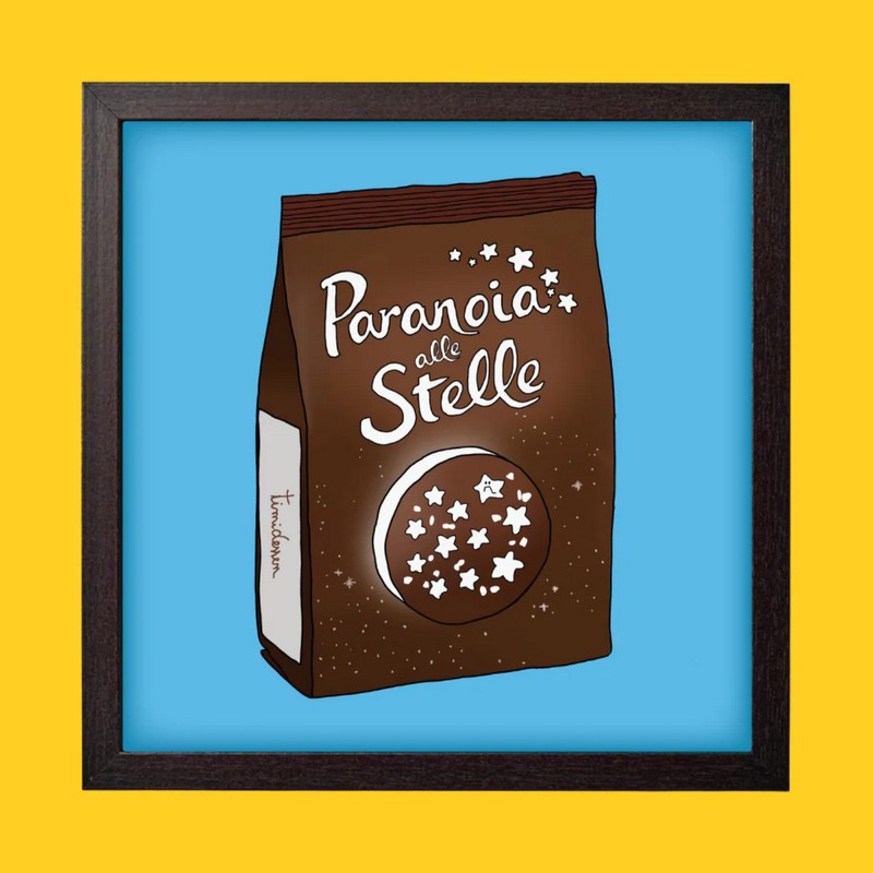 Quadro con cornice nera in legno con poster Paranoia alle stelle su biscotti