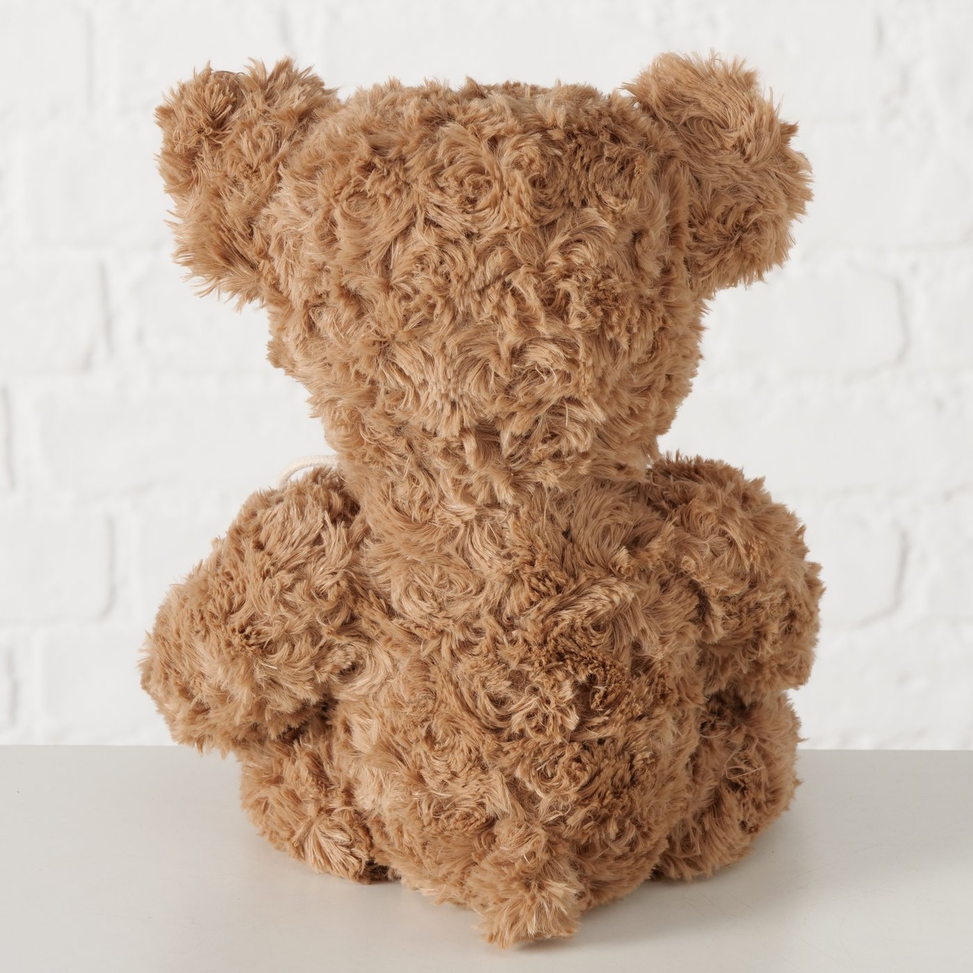 Peluche morbido a forma di orsetto marrone con sacco rosso