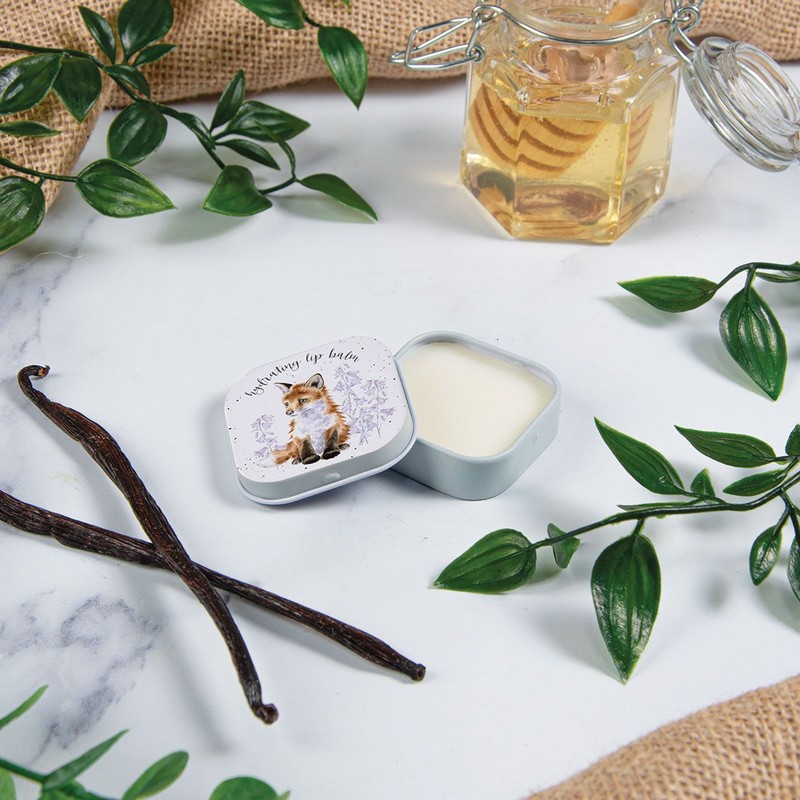 Balsamo per labbra al profumo di miele e vaniglia contenuto in scatola di latta decorata con cucciolo di volpe