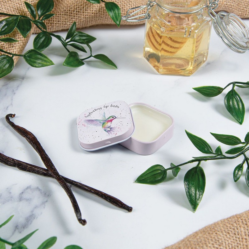 Balsamo per labbra al profumo di miele e vaniglia contenuto in scatola di latta decorata con colibrì
