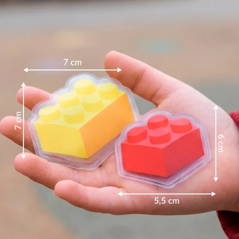 Set 2 scaldamani riutilizzabili a forma di blocchetti Lego, uno giallo e l'altro rosso