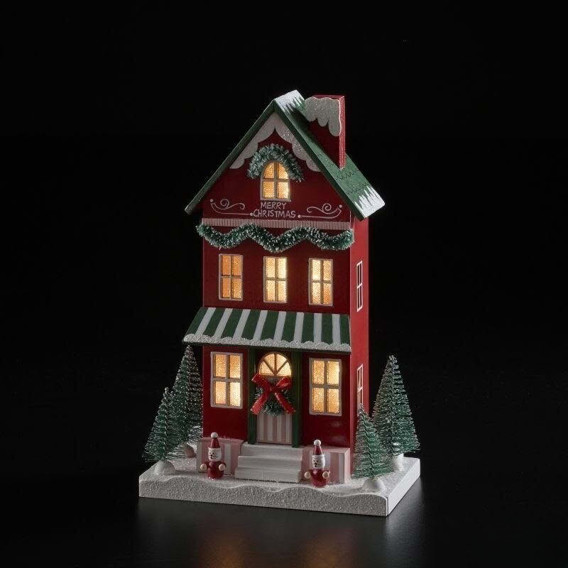 Casetta di Natale innevata in legno rosso con ghirlande, Babbo Natale, alberi e luce led, perfetta come decorazione di Natale