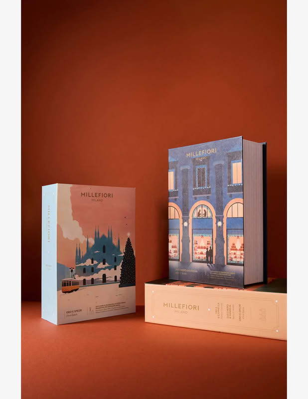 Cofanetto Millefiori in confezione con grafica a tema Natale milanese contenente una candela e un diffusore 100 ml di fragranza Oro e Spezie, per un bellissimo ed elegante regalo di Natale